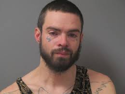 Man charged with breaking into home, stealing liquor