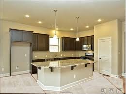 dark kitchen cabinets with tile floor