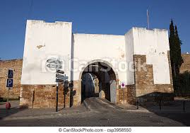 Get your free portugal report today! Gate To The Old Town Of Faro Algarve Portugal Canstock