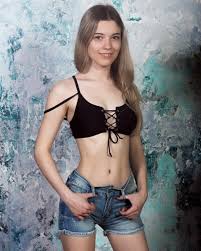 Her arousing stance emphasizes her stunning nude curves