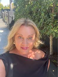 How to change cabinet color using Remodel AI app's reskin feature?