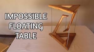 A roof truss is a structural framework of timbers designed to bridge the space above a room and to provide support for a roof. Make An Impossible Floating Table Tensegrity Table Youtube