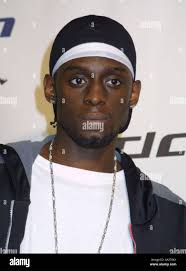 Los Angeles Clippers' Darius Miles, left, is fouled by Minnesota  Timberwolves' Reggie Slater (35) during the first half in Los Angeles,  Friday, April 13, 2001. (AP Photo/E.J. Flynn Stock Photo