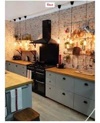 Low Hanging Light Bulbs Hanging Utensils Brick Effect Wall Kitchen Inspirations Kitchen Design Rustic Kitchen