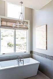 The Master Bath Lighting Above The Tub Is A From Shades Of Light Timber Frame Home With Farmhouse Inspired Interior Timber Frame Homes Farmhouse Bathroom Home