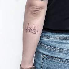 Here Are 35 Beautiful Single Line Tattoos Blurmark Line Tattoos Hands Tattoo Hand Holding Tattoo