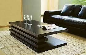 this particular coffee table is made of wood it has a simple design it has no legs so coffee table design modern contemporary coffee table coffee table design