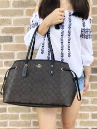 Black And Brown Coach Purse Coach F57842 Signature Pvc Drawstring Carryall Tote Brown Black Large Handbag Carryall Tote Carryall Bags Designer