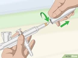 Using an airbrush gun involves pushing down the trigger and then pulling it back in varying degrees to excrete the paint at different line widths. How To Clean An Airbrush Gun With Pictures Wikihow