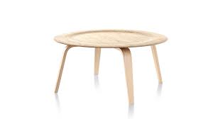 Formed by breakthrough technology that molds plywood veneer into curved shapes, its round top is slightly indented and comes in a range of finishes. Eames Molded Plywood Coffee Table Herman Miller Tables
