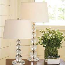 This table lamp offers a light, airy presence and a captivating optical effect with its crystal body and base. Rodeo Crystal Table Lamp With Cream Lamp Shade Lux Street Online