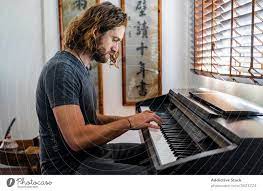 These lessons could be a part of the daily schedule online with students at home, or added to resources for parents. Talented Man Playing Piano At Home A Royalty Free Stock Photo From Photocase