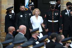 She has a police radio attached to her uniform so she can call for backup. 9jlxuabekk4wkm