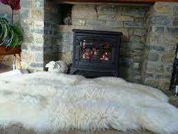 sheepskin rug in front of the fireplace grosser fireplace rugs fur rug fireplace quality living room furniture