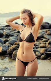 Beautiful woman in black bikini Stock Photo by ©luengo_ua 152884600