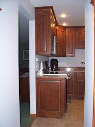 Use the side moulding miters to position and mark the top and bottom mouldings for the kitchen cabinet side panels. Custom Cherry Kitchen Cherry Kitchen Cherry Cabinets Kitchen Kitchen