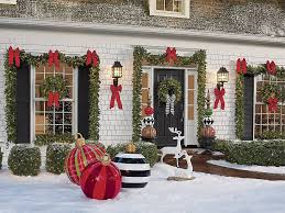 Santa claus sitting with gift boxes on sofa at decorated home during christmastime. Christmas Porch Decorations 15 Holly Jolly Looks Grandin Road Blog