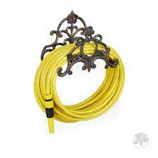 Designed to accept up to a standard 100' x 5/8 garden hose (using large loops). Relaxdays Antique Hose Holder Cast Iron Vintage Look Wall Mounted Hxwxd 24 X 31 5 X 15 Cm Garden Hose Hanger Bronze Buy Online In Bahamas At Bahamas Desertcart Com Productid 50890109
