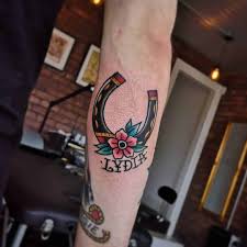Native wings horse shoe tattoo on upper back. 20 Distinguished Horseshoe Tattoo Ideas And Meanings