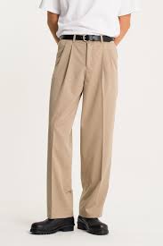 Characterized by slowness, sluggishness, or lack of energy a slack pace b : Menswear Wide Pintuck Slacks Sand