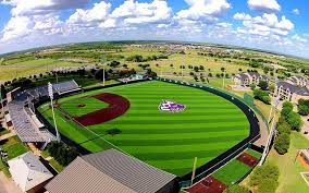 Indoor baseball facility two fixed shell batting cages with 6 batting tunnels batting cages retract for full turf field area turf, netting, training products & installation all provided by on deck sports Abilene Christian Baseball Camps Abilene Texas