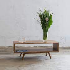 Our cafe tables and matching cafe chairs are designed to be used indoors or out. Amara Mid Century Timber Coffee Table Rectangle With Open Shelf Living By Design