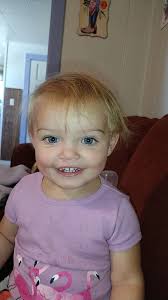 Who does she look like more me or her dad?