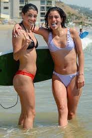 Charli D'Amelio and Dixie D'Amelio slip into their bikinis while enjoying  the beach in