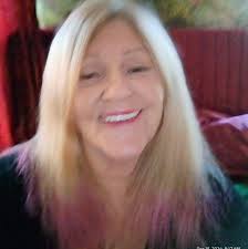 What is this plant growing in my Iowa backyard garden bed?