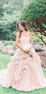 From pale pink to rose gold wedding dresses, be a blushing bride in any of these stunning pink wedding gowns and dresses. Blush Pink Wedding Dresses Country Weding Dresses Ball Gown Wedding Dress Rustic Wedding Dress Ruffle Wedding Dress Pink Wedding Dresses Wedding Dresses Blush