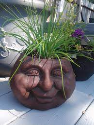 But it also includes some &… I Found This Planter At Rite Aid Of All Places Would Love To Have Several More With Different Expressions On The Face Face Planters Clay Planters Garden Art