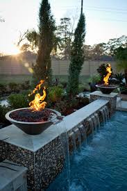 From glowing fire bowls to cozy fire pits by the pool, today's pool buyers are asking their pool designers to find new and unique ways to incorporate exciting flame features into their pools. Multi Level Pool With Fire Water Bowls Traditional Swimming Pool Hot Tub Houston By C S W Creations Houzz Ie