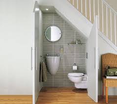 Here Is A Good Example Of A Modern Bathroom Below A Staircase Notice The Wall Mounted Sink Whi Bathroom Under Stairs Small Bathroom Remodel Bathrooms Remodel