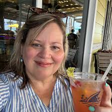 Should I use a cookie sheet under a disposable cardboard baking pan for  cookie cakes?