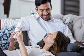 To make any of these moves work, you have to feel the sexual tension in the air. Young Couple Relaxing On Sofa Looking At Mobile Phone After Work By Trinette Reed Working From Home Working Stocksy United