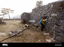 boy discovering remains of ruined church Sveta Katarina (St Catherine),  Karst, Slovenia Stock Photo