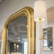 The white glass shade emits a beautifully soft light perfect for any room. Worlds Away Virginia Wall Sconce Gold Leaf Clayton Gray Home