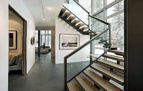 Glass Stair Railing In Staircase Modern With Floor To Ceiling Windows Beige Wall Staircase Railing Design Modern Stairs Modern Staircase
