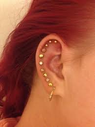 15 Pretty Ear Piercings That Ll Inspire You To Add More Studs Stat Pretty Ear Piercings Piercings Ear Piercings