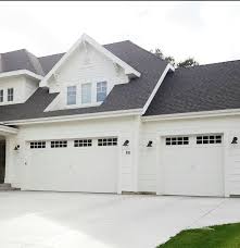 Black And White House With Wood Garage Door Whitelane Decor Garage Doors Garage Door Design Carriage Style Garage Doors