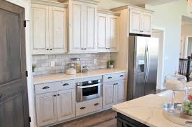 The behr paint is used in this design to color the kitchen cabinets. Aspen Homes Antique White Painted Cabinets With Gray Stained Accents Farmhouse Kitchen Other By Village Home Stores Houzz