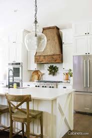 Charming Rustic Farmhouse Kitchen With Alabaster Cabinets Cabinets Com White Shaker Kitchen Cabinets Cozy Kitchen Rustic Farmhouse Kitchen