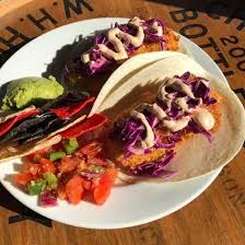 Wrapped in a warm corn tortilla and loaded with a generous helping of baked tilapia and your favorite toppings, these tacos are amazing! Friday Special Fish Tacos Hand Breaded Tilapia Fillets Fried Served With A Soft Tortilla With Lime Slaw Guacamole And Salsa Fresca Picture Of Hillsboro Brewing Co Tripadvisor