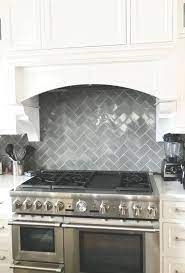 Off white kitchen cabinets are a great choice for designers and homeowners who wish to add a little variety to their kitchen without feeling pressured to incorporate different colors. Clarendon Hills Kitchen Herringbone Backsplash Set With Shiny Gray Subway Tile Kitchen Herringbone Backsplash Grey Subway Tiles Kitchen Remodel