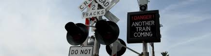 These signs are large circles with a yellow background, a black x in the middle and an r on each. Led Preemptive Train Warning Signs Secondary Warning Train Crossing Signs Signal Tech