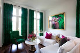 Vibrant green silk wall panels and a ceiling clad in gold teapaper add glamour to the dining room of in the dining room, which was modeled on a czarist winter garden, emerald velvet upholsters a positioned beneath a baccarat chandelier, a vintage table and chairs anchor the dining area of a são. You Should Never Do This At A Paint Store Living Room Green Emerald Green Living Room Living Room Accents