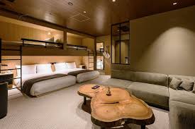 University oak extra long twin over queen bunk bed. Inside 8 Chic Hotel Guest Rooms Where Four S Never A Crowd Architectural Digest