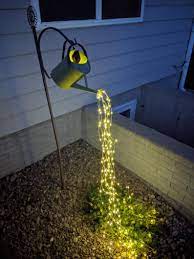 Watering Can With Solar Powered Fairy Lights Etsy In 2021 Solar Powered Fairy Lights Fairy Lights Watering Can With Lights