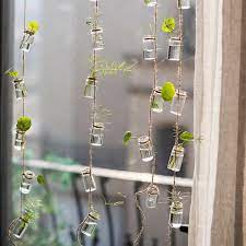 This hanging planter turns a log slice into a perch for indoor plants, so you can have the best of fall's rustic vibes without giving up the greenery of summer. Pin On Rustic Reach Glass Planter