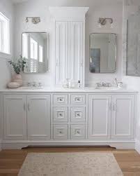 White Master Bathroom With Custom Cabinetry Double Sconces And Vintage Rug Masterbathr White Master Bathroom Double Vanity Bathroom Bathroom Remodel Master